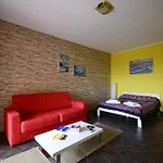 Residenze L'isola Surf House アパートホテル 4*